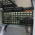 Ineos Grenadier Interior Side Window MOLLE Panel – Mounted in the Cargo Area of a 4x4 Vehicle