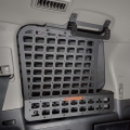 Interior MOLLE Panel Mounted on the Side Window in the Cargo Area of a Toyota Land Cruiser 200 Off-Road Vehicle with Attached Expedition Accessories