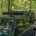 Roof rack mounted on Ineos Grenadier – black aluminum expedition platform